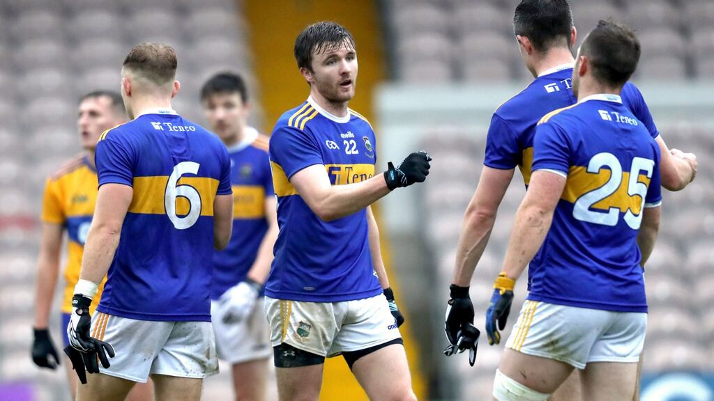 Tipperary’s Colman Kennedy touches knuckles with his teammates after their win over Clare in the Munster Senior Football Championship. Photo: Bryan Keane/Inpho