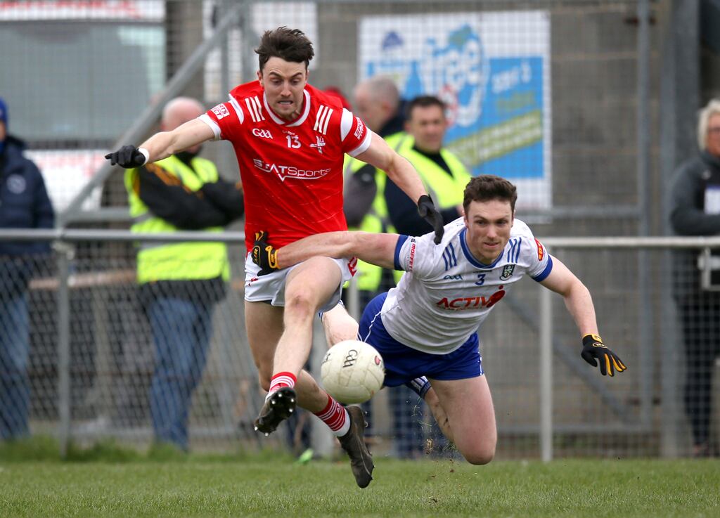 Louth's Daire McConnon competes with Monaghan's Killian Lavelle. Photograph: Leah Scholes/Inpho