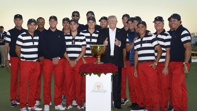 Tiger Woods and the rest of the US President’s Cup team post with Donald Trump at Liberty National in October. Photo: Getty Images