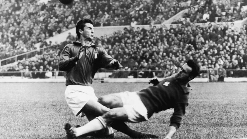 Italy’s Angelo Sormani collides with Switzerland’s Heinz Schneiter during a 1962 World Cup game. Photograph: Keystone/Getty