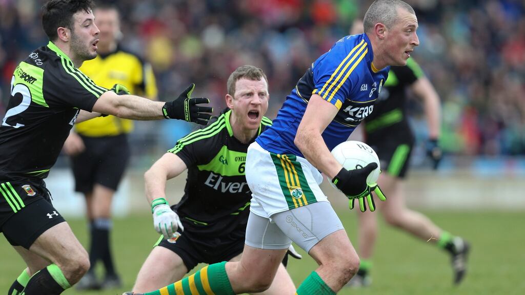 Kieran Donaghy of Kerry gets away from Cathal Carolan and Colm Boyle in Castlebar. Photograph: Andrew Paton/Inpho