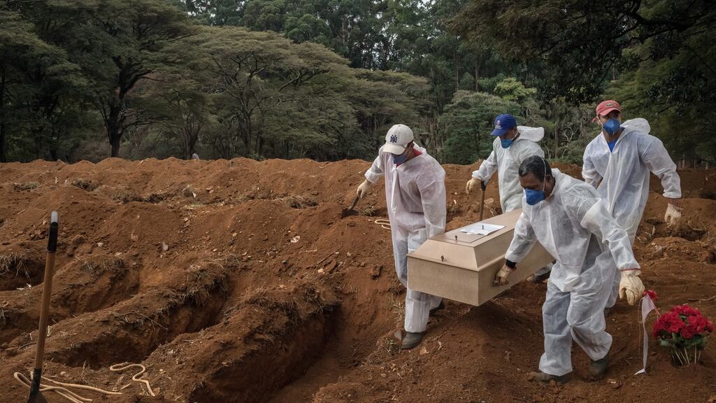Gravediggers carry the coffin of a Covid-19 victim during a burial at Vila Formosa cemetery in São Paulo on May 8th, 2021. Photograph: Mauricio Lima/The New York Times