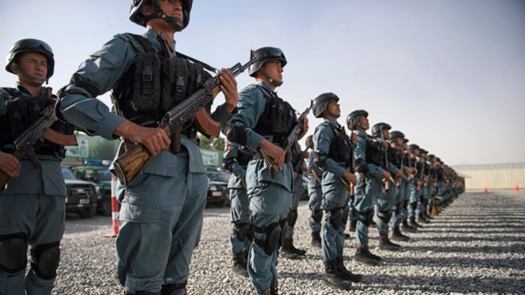 Police officers prepare for a patrol in Kabul today.  Photograph: Lynsey Addario/The New York Times