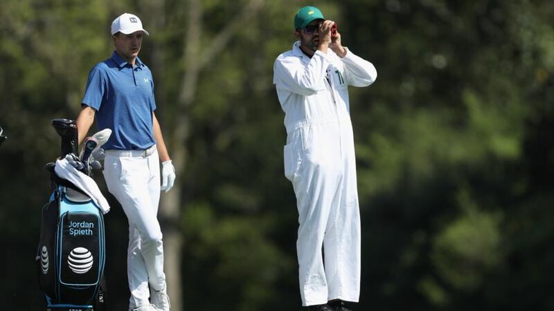 Jordan Spieth  waits to play a shot with caddie Michael Greller during a practice round prior to the start of the 2018 Masters. Photograph:  David Cannon/Getty Images
