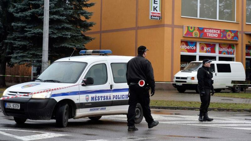 Police officers patrol near a restaurant where a gunman opened fire in Uhersky Brod. Photograph: Reuters