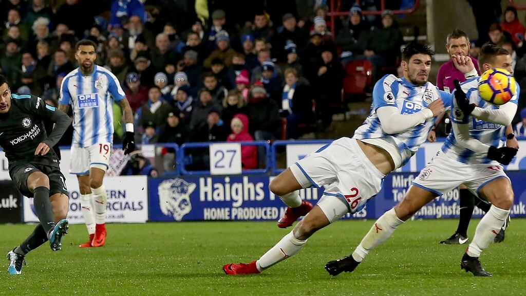Chelsea’s Pedro scores his side’s third goal in their Premier League win over Huddersfield Town. Photo: Nigel Roddis/EPA