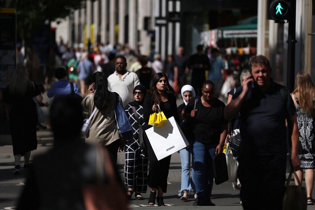 Shoppers on Oxford Street in London. The UK economy exited recession.