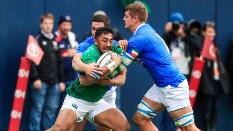 Bundee Aki holds off Luca Morisi and Johan Meyer. Photo: Tannen Maury/EPA