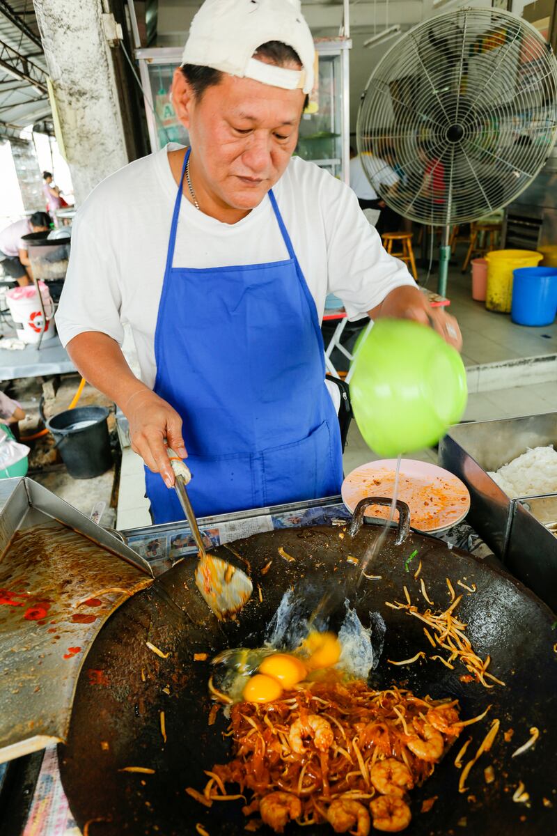 Street food vendor in George Town preparing char koay teow