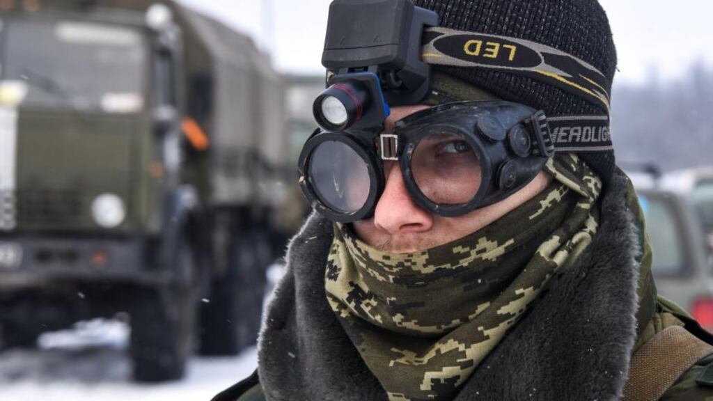 A pro-Russian rebel guards the road near Donetsk airport in eastern Ukraine. Ukrainian soldiers took up duties at the airport on Tuesday. It has been the scene of some of the fiercest fighting in eastern Ukraine. Photograph: Mstyslav Chernov/AP