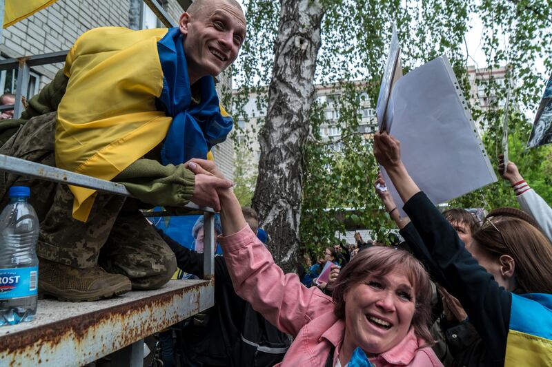 Anzhelika Yatsyna reacts as Serhiy Laptiev confirms that her brother is still alive. Photograph: Brendan Hoffman/New York Times
