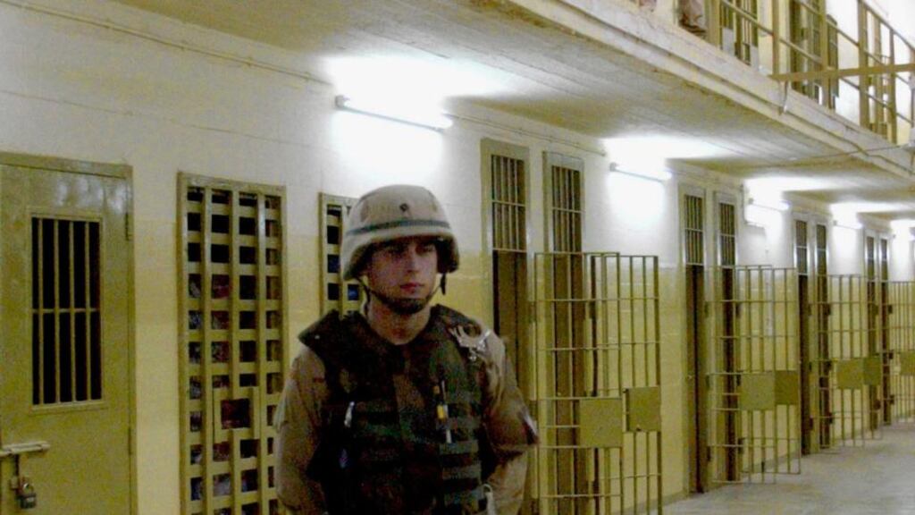 A file photograph of a US soldier standing near cells  where high risk detainees are kept at Abu Ghraib prison. About 500 inmates, some of them senior al-Qaeda figures escaped the prison today. Photograph: Reuters.
