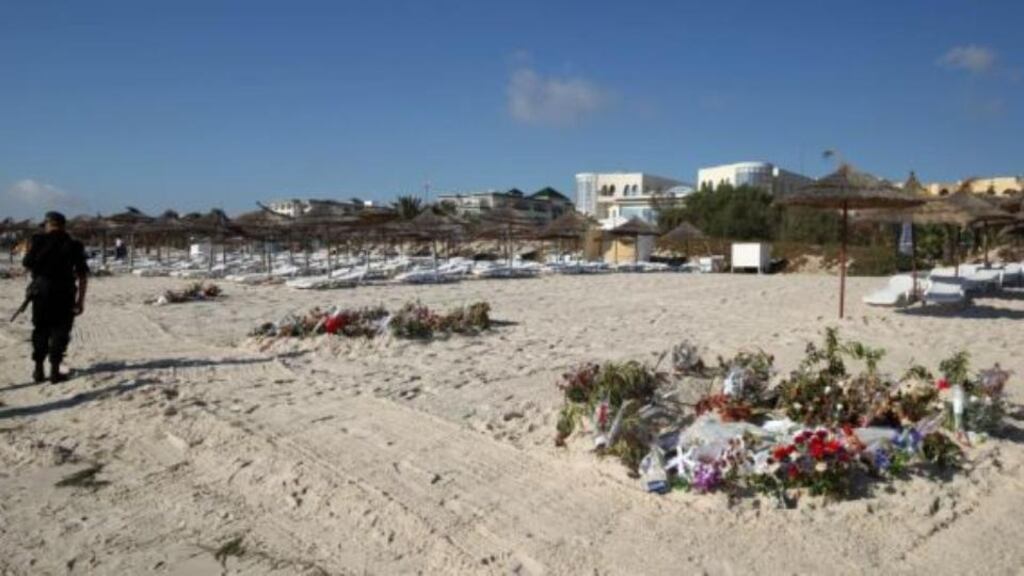 Flowers on the beach near the RIU Imperial Marhaba hotel in Sousse, Tunisia, where 38 people lost their lives after a gunman stormed the beach last month. Photograph: Steve Parsons/PA Wire.