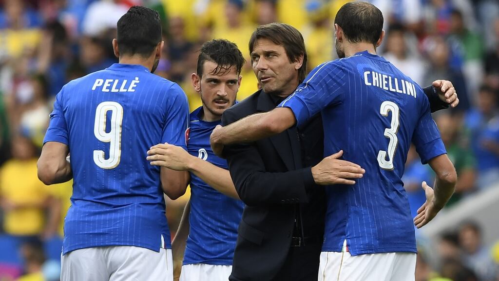 Italy’s coach Antonio Conte celebrates with his players after the match. Photo: Getty Images