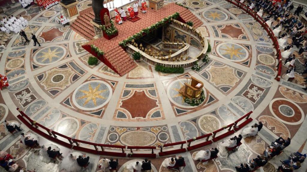 A semi-general view the  brides and their grooms as they  stood before Pope Francis (top centre) as he celebrates a mass wedding ceremony inside St. Peter’s Basilica today. Photograph: Alberto Pizzoli/EPA