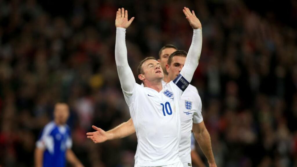 England’s Wayne Rooney celebrates scoring his side’s second goal from the penalty spot. Photo: Nick Potts/PA Wire.
