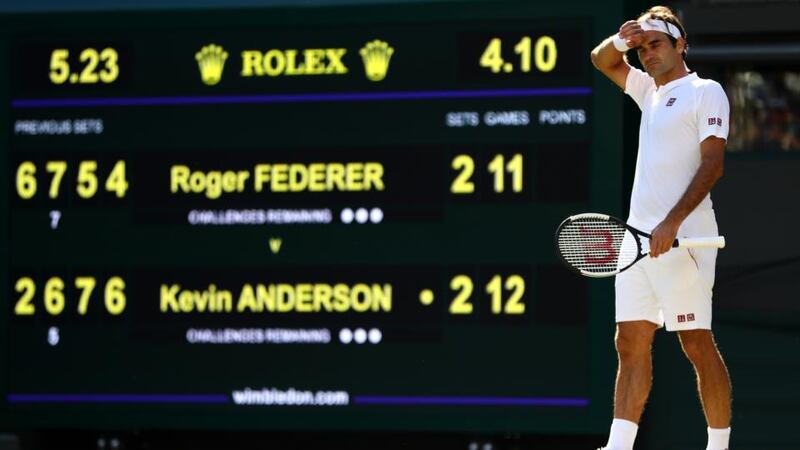 Roger Federer wipes his forehead during his quarter-final match against Kevin Anderson at Wimbledon. Photograph: Michael Steele/Getty Images