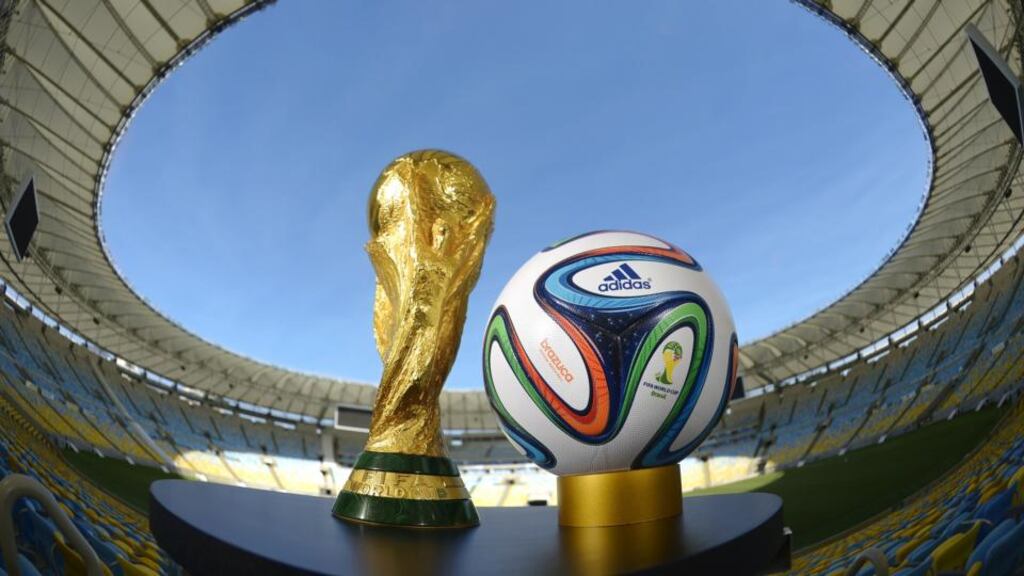 The ‘brazuca’ and the Fifa World Cup Trophy at the Maracana today. Photograph: Alexandre Loureiro/Getty Images)
