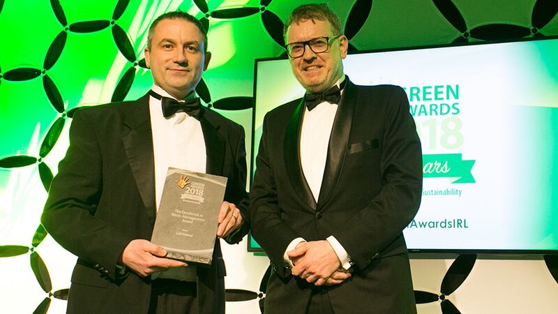 Eoin, Lonergan, Director, Performance Improvement Advisory, EY presents The Excellence in Waste Management award to Hugh McAfee, Lidl Ireland.