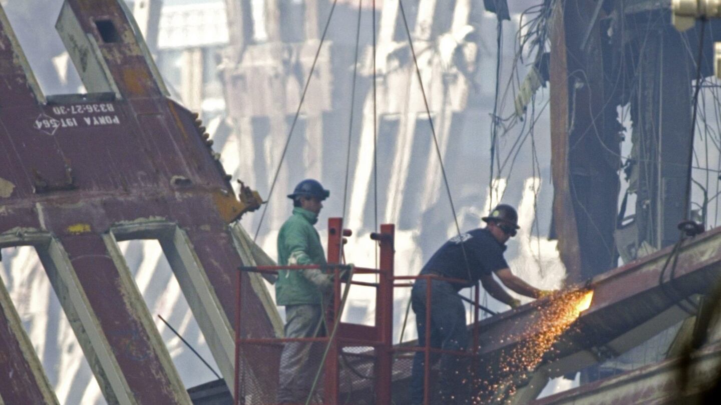 Workmen  dismantle the destroyed remains of the World Trade Center in New York, New York, USA on September 16th, 2015.  Photograph: EPA