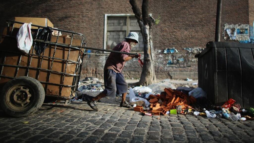 A man pulls a cart with recyclables he has collected to exchange for money near the Virgin of the Miracles of Caacupe church in Buenos Aires where Archbishop Jorge Bergoglio, now Pope Francis, used to perform charity work. Photograph: Mario Tama/Getty Images