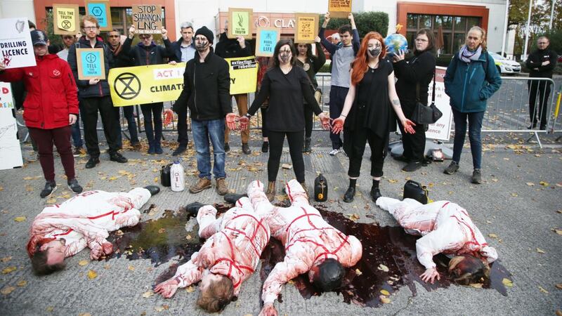 Extinction Rebellion Climate Activists Fabian Mac Ginty O Neill, Leontien Friel Darrell, Jamie O’Neill and Sarah Doherty staged non-violent, direct action outside the Burlington Clayton Hotel in Dublin. Photograph: Stephen Collins/Collins Photos