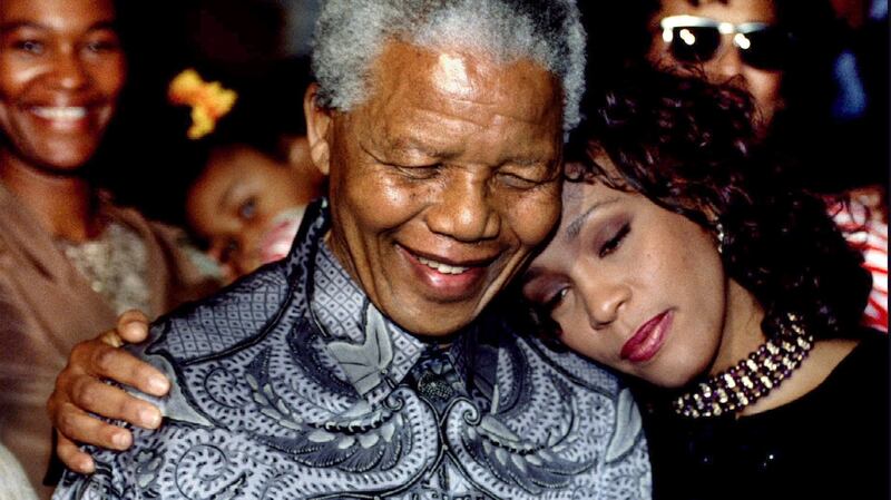 South African president Nelson Mandela and Whitney Houston smile for photographers in Johannesburg on November 10th, 1994. Photograph: Juda Ngwenya/Reuters