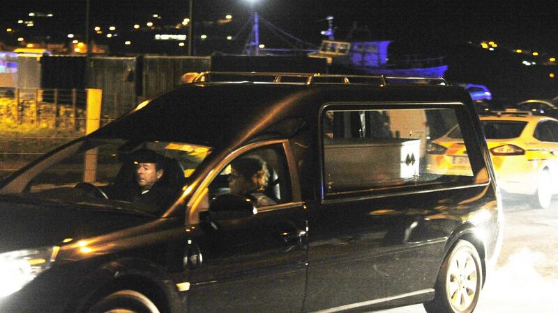 A coffin carrying the body of a child is taken from the scene at Buncrana, Co Donegal on Sunday night. Photograph: Trevor McBride
