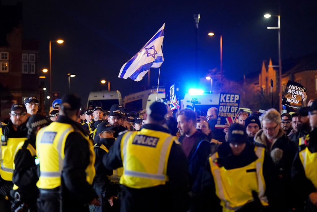 Pro-Israel supporters are led away from Villa Park, home of Aston Villa, by police officers before the Uefa Europa League match against Maccabi Tel Aviv last night. Photograph: Jacob King/PA Wire
