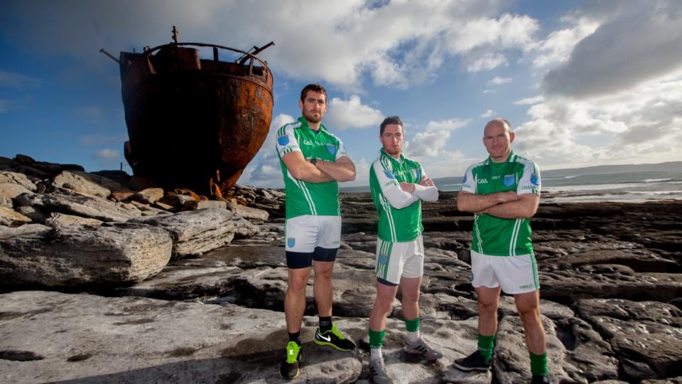From left: Máirtín Stiofán Seoighe, Cillian Ó Conghaile and Eoghan Póil, three Inis Oírr members of the Oileáin Árainn football team standing in front of the Plassey shipwreck on the island. Photograph: Seán Ó Mainnín