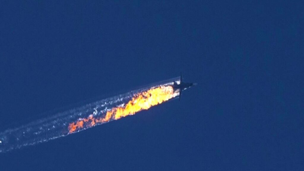 A still image from video footage shows a burning trail as a plane comes down after being shot down near the Turkish-Syrian border. Photograph: EPA