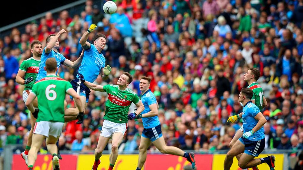 Brian Fenton and Michael Darragh Macauley attack a Mayo kickout in the semi-final. Photogaph: Tommy Dickson/Inpho
