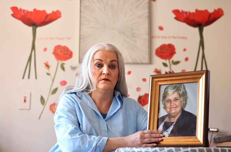 Mary Donovan, at her home in Co Tipperary with a photograph of her mother Mary-Margaret. 'How many other women like her were locked away and still nobody knows about them?' Photograph: Dara Mac Dónaill