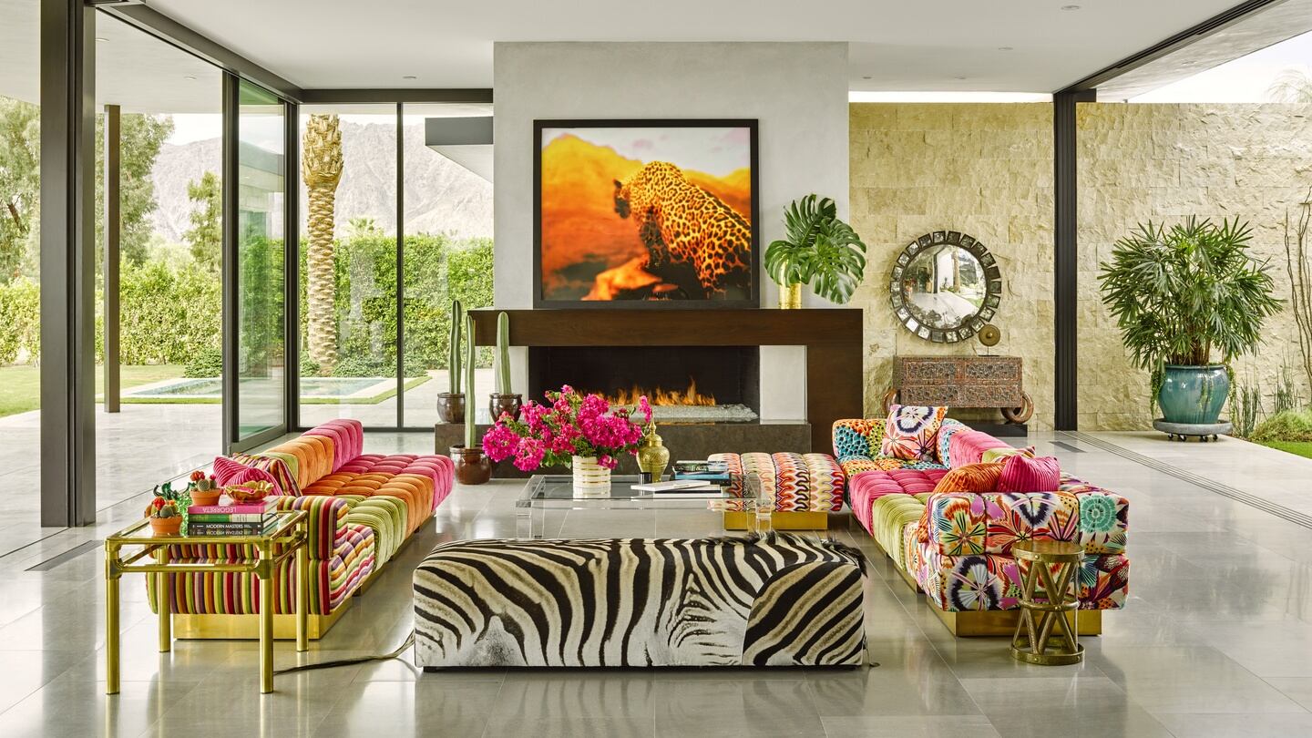 A Rat Pack-inspired house in Palm Springs which has custom-made sofas set on brass plinths and upholstered in Missoni fabrics and a zebra-clad ottoman, a signature print of Fulks. Photograph: Douglas Friedman Photography