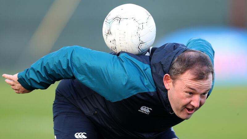 Kicking coach Richie Murphy tries some skils with the round ball. Photo: Billy Stickland/Inpho