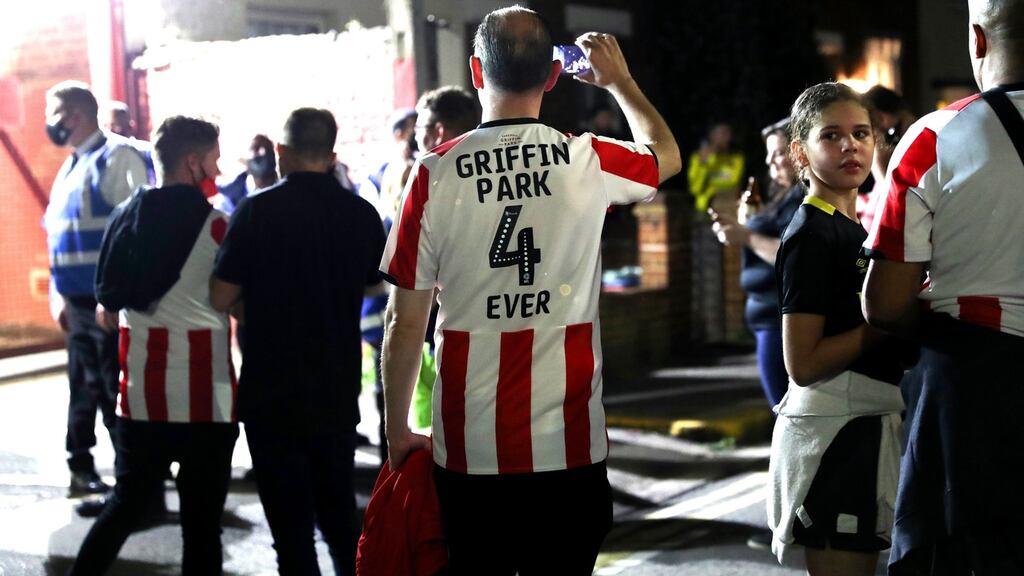 A fan clad in Griffin Park 4 Ever shirt as Brentford play their final match at the stadium during the Championship play-off semi-final second match against Swansea City. The Bees are moving to a new stadium. Photograph: Getty