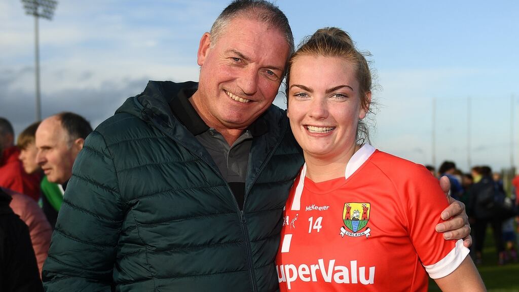 Saoirse Noonan of Cork with her father, Peter, following the TG4 Ladies Munster senior football final victory over Waterford at Fraher Field in Dungarvan. Photograph: Harry Murphy/Sportsfile