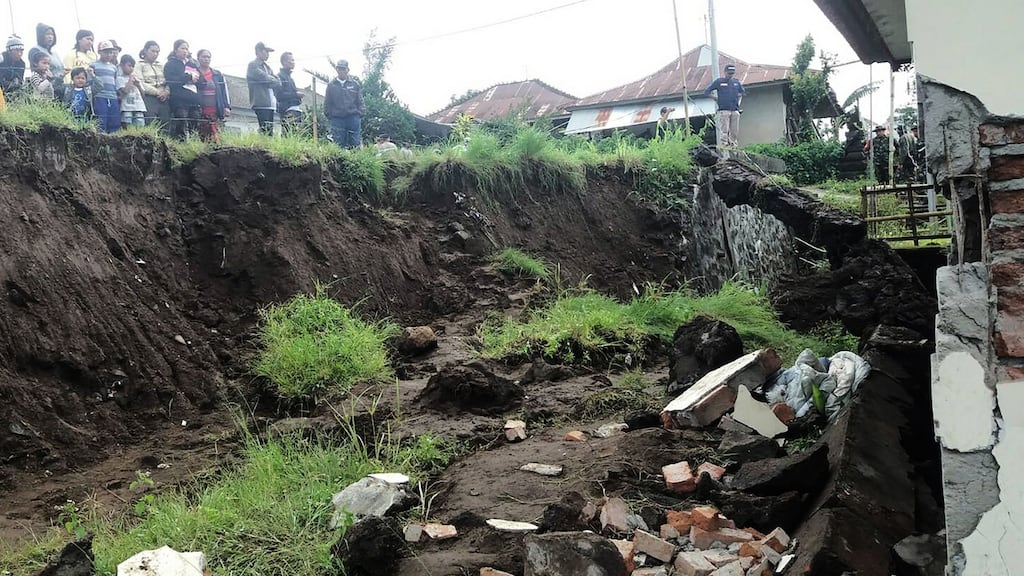 Villagers look at a house which was damaged in a landslide in Kintamani, Bali on February 10th. Photograph: AFP/Getty Images