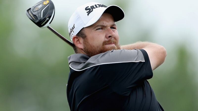 Shane Lowry watches his tee shot on the 18th hole. Photo: David Cannon/Getty Images