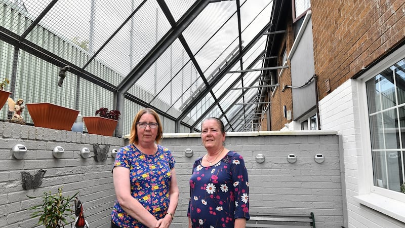 From left, sisters Patsy and Jean Canavan live on Bombay Street, west Belfast. The Canavan family moved back to Bombay Street a year after they were burned out, at the start of the Troubles. Photograph: Colm Lenaghan/Pacemaker