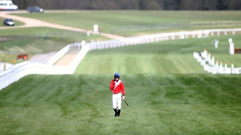 Jockey  Jack Kennedy walks back along the course after falling from Envoi Allen during the Marsh Novices’ Chase on day three of the Cheltenham Festival. Photograph:  Tim Goode-Pool/Getty Images