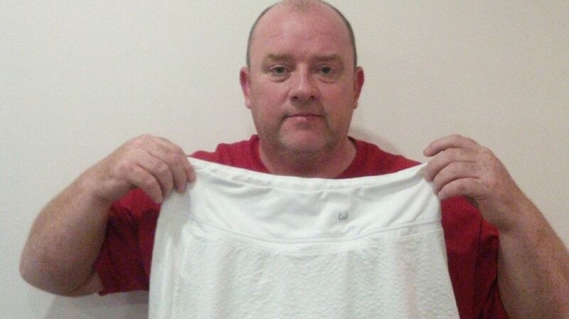 Chris Quinn, who was invited onto the Wimbledon court,  by Kim Clijsters, said he is going to put the skirt she gave him up for auction in aid of charity. Photograph: Chris Quinn