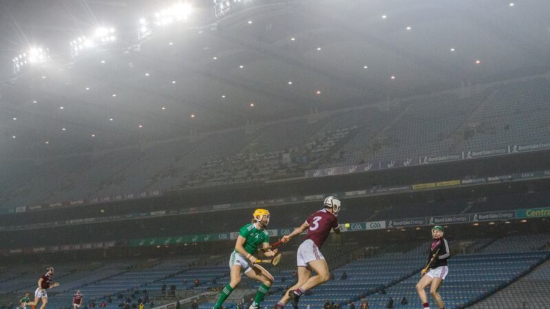 Limerick’s Barry Nash with Galway;s Daithi Burke and goalkeeper Eanna Murphy. Photograph: James Crombie/Inpho