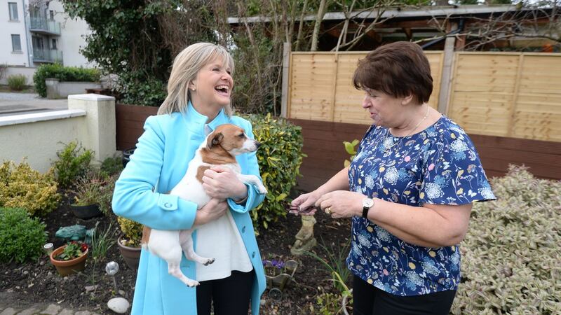 Fianna Fáil general election candidate Deirdre Heney speaking to Elizabeth Wright and her dog Minnie while canvassing in Clontarf. Photograph: Alan Betson / The Irish Times