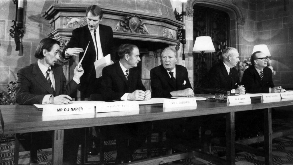 Former taoiseach Liam Cosgrave, the British prime minister Edward Heath, Brian Faulkner, of the Ulster Unionist Party, and Gerry Fitt for the SDLP, signing the communique, watched by the other signatory Oliver Napier (far left) of the Alliance Party, on the agreement to form a Council of Ireland. Photograph: Ciaran Donnelly