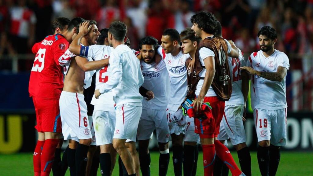 Sevilla’s players celebrate after their 3-0 Europa League semi-final first leg win over Fiorentina. Photograph: Getty