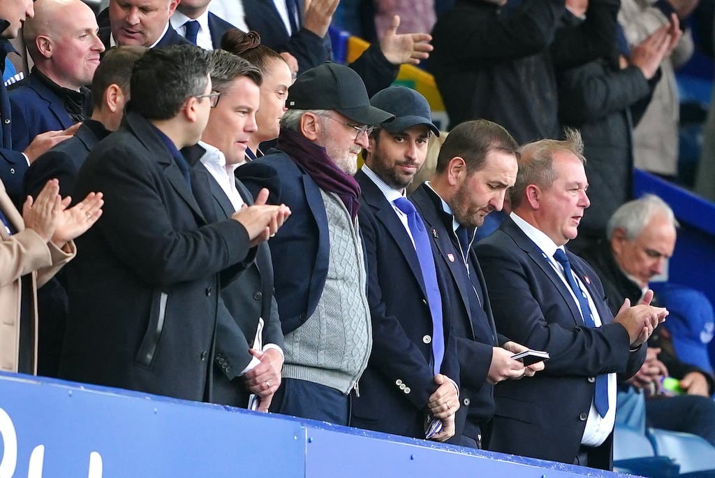 Josh Wander (in baseball cap and blue tie) of 777 Partners at an Everton game in 2023. He is alleged to have defrauded lenders and investors. Photograph: Peter Byrne/PA Wire