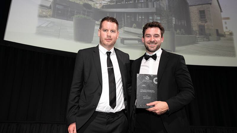 Nick Samuels, National Sales Manager, SAS International, presents the Building Refurbishment for a Single Building or Development award to Jack Byrne, ALTU Architects.