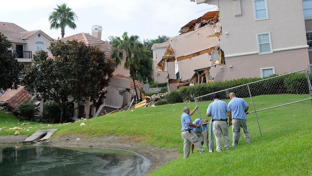 Summer Bay Resort employees install barricades around the collapsed building by a sinkhole at Summer Bay Resort near Walt Disney World on August 12, 2013 in Clermont, Florida. Photograph: by Gerardo Mora/Getty Images