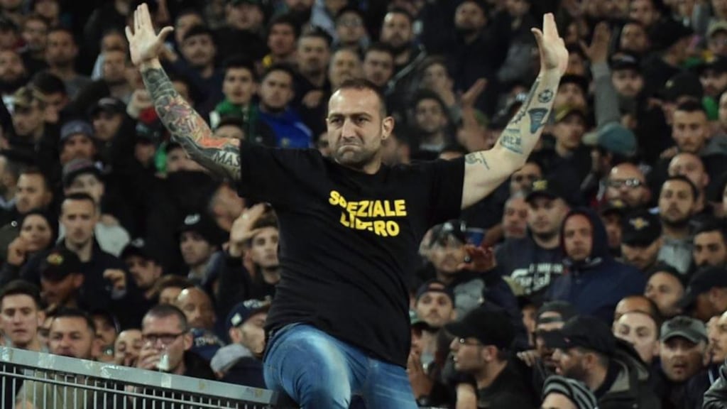 Gennaro de Tommaso, the leader of SSC Napoli ‘Curva A’ supporters, wears a shirt reading ‘Speziale Libero’ as he sits on the railing prior the Italy Cup final. Photograph: EPA